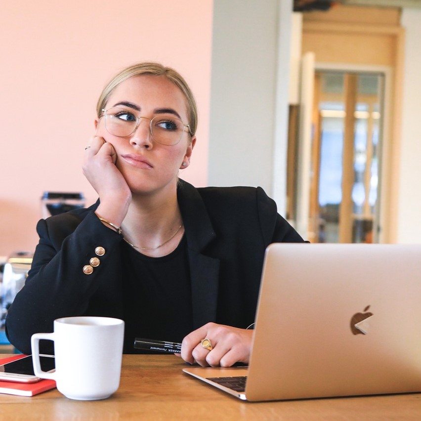 Apathetic person sitting at a desk.
